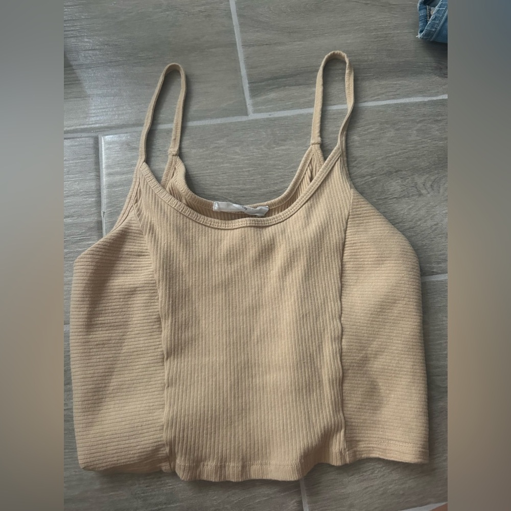 It’s a tan cropped tank top it’s new I have never worn it